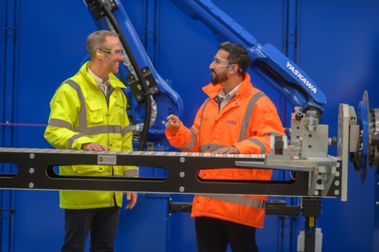 20260412 - Booth Industries MD, Mike Jenkinson (in yellow), and HS2 Ltd Head of Rail Systems Delivery, Qasir Raza at the cross-passage door factory in Bolton-4