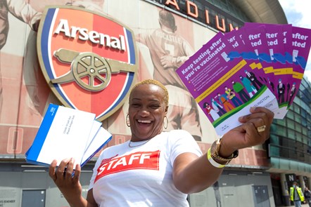 A volunteer outside the Covid-19 vaccine event at Emirates Stardium