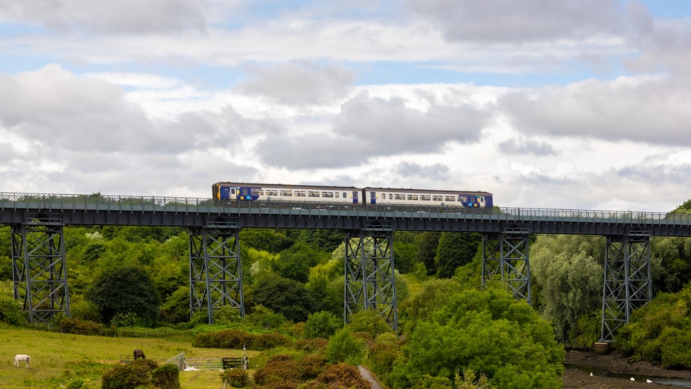 An image of a Northumberland Line service crossing the North Seaton Viaduct