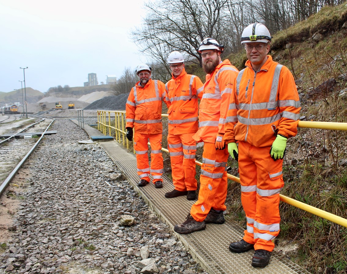 (L-R): Mark Grimshaw-Smith (Rail & Sea Manager CEMEX), Oliver Paget (Lead Route and Freight Manager, Network Rail), Nathan Moffatt (Operations Manager, GBRf) and Dale Holford (Driver Operator, Victa Railfreight).