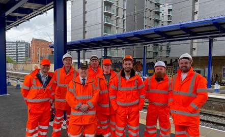 Image shows engineers at Salford Central station ahead of the re-opening