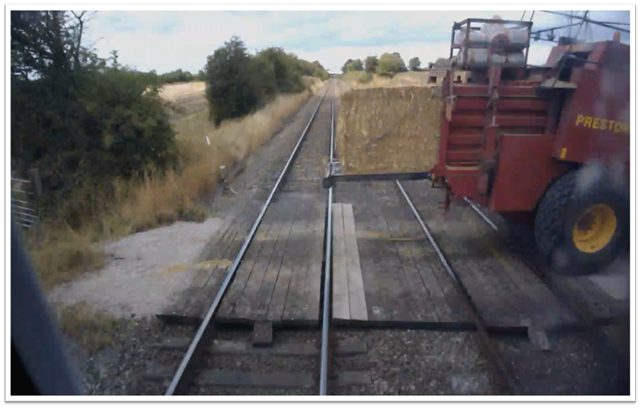 train travelling 85mph narrowly misses farm vehicle at level crossing  1