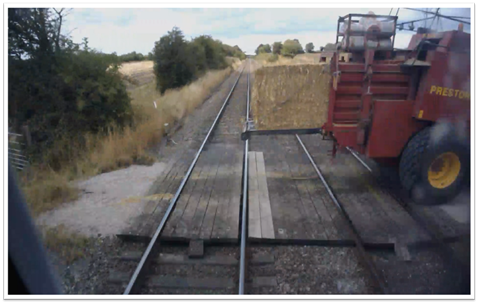 train travelling 85mph narrowly misses farm vehicle at level crossing 1
