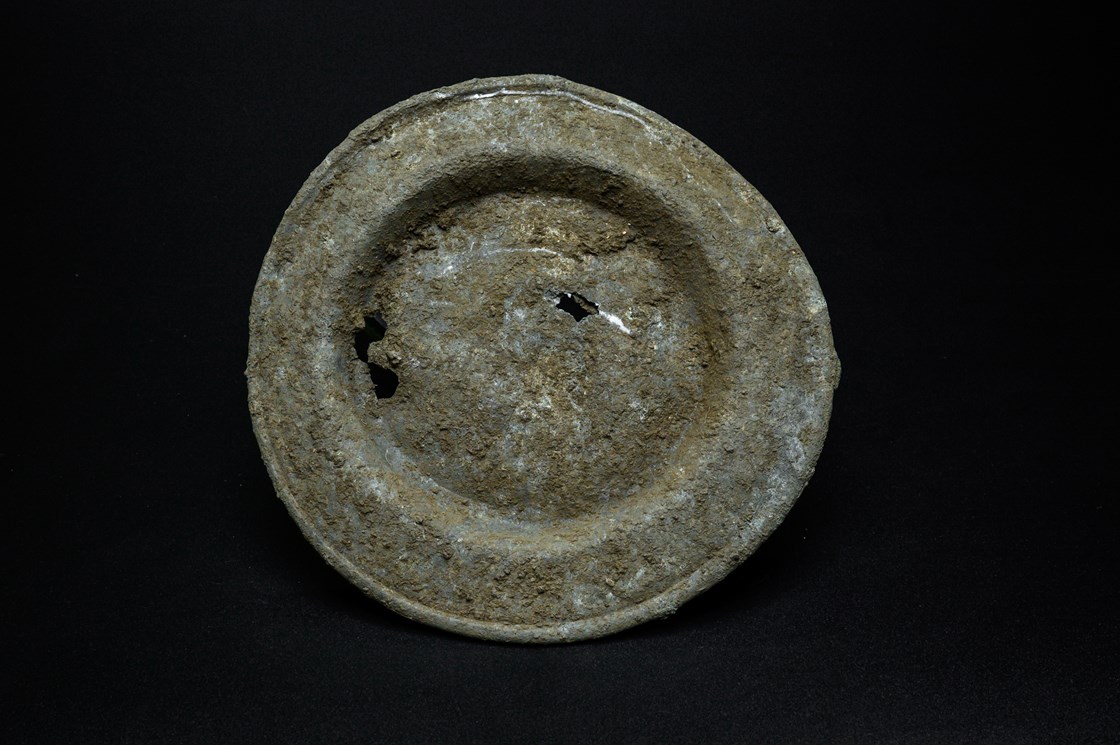 Pewter plate uncovered during the archaeology excavation at Blackgrounds, Chipping Warden, Northamptonshire