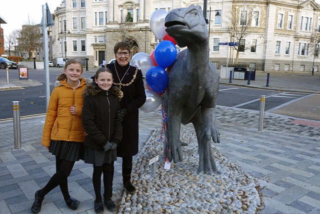 Iggy the dinosaur outside Maidstone East's new station building: Mayor of Maidstone cllr Faye Gooch with students from Allington Primary School and Iggy the dinosaur
