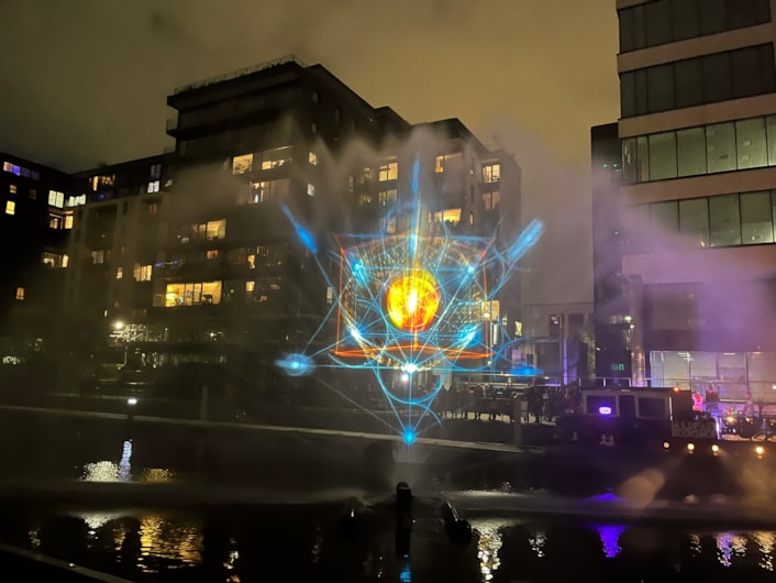 Light Night 2024: At Leeds Dock, Norwegian artist Anastasia Isachsen’s stunning Monad, was projected onto the water, taking inspiration from nature and the universe and accompanied by a compelling soundscape.