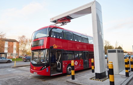 A zero-emission electric bus under a pantograph charging point at Go-Ahead's Bexleyheath bus depot in south-east London.