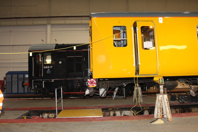 The old and the new  - Class 313 to be fitted with ERTMS, next to a Class 08: The old and the new: Class 313 at Alstom's Wembley depot, awaiting ERTMS fitment for use on the Hertford Network Integration Facility, sits next to a 1950s design Class 08