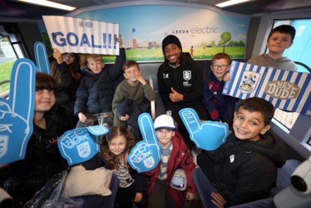David Kasumu meets young fans on the bus