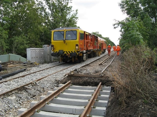 Tamping work being carried out on Swindon to Kemble railway: A three-week major programme of work to realign 6miles of track as part of Swindon to Kemble railway redoubling scheme