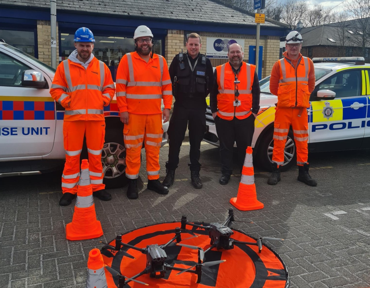 An image of a British Transport Police officer with Northern and Network Rail staff involved in the crackdown on trespassing in the North East