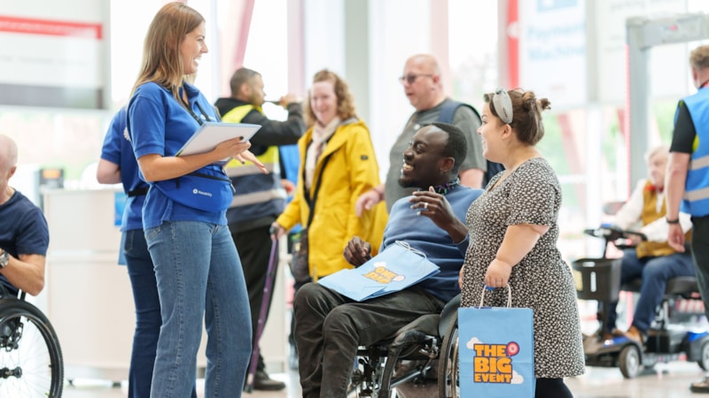 The Big Event 2024-3 cropped: Two customers speak to Motability Scheme representative at the Big Event