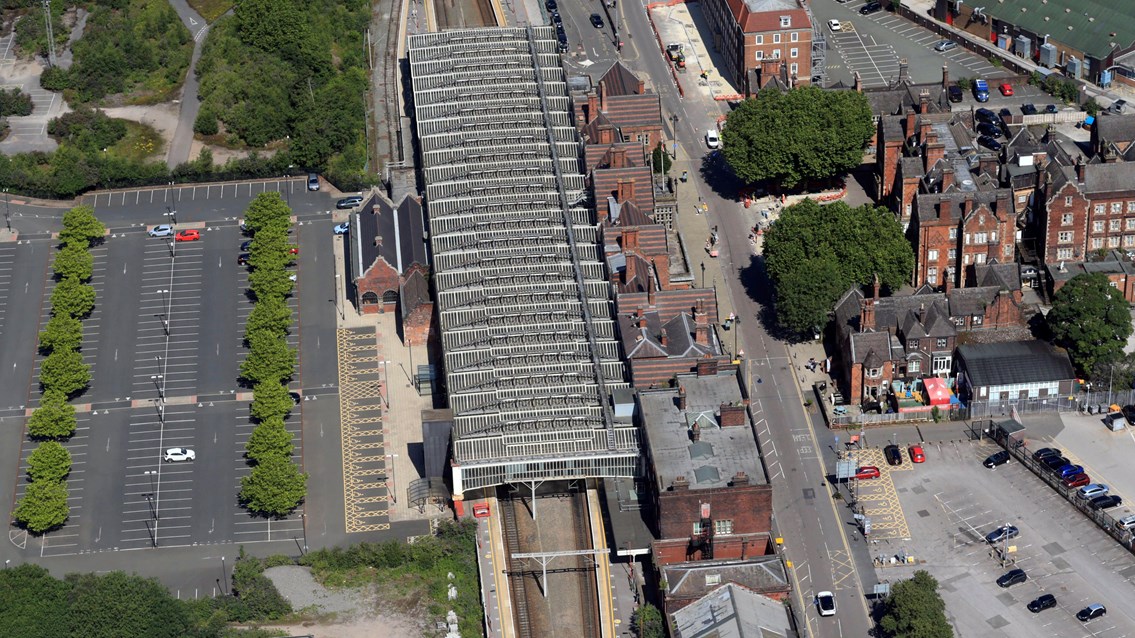 Helicopter shot of Stoke-on-Trent station train shed looking towards Southern gable end