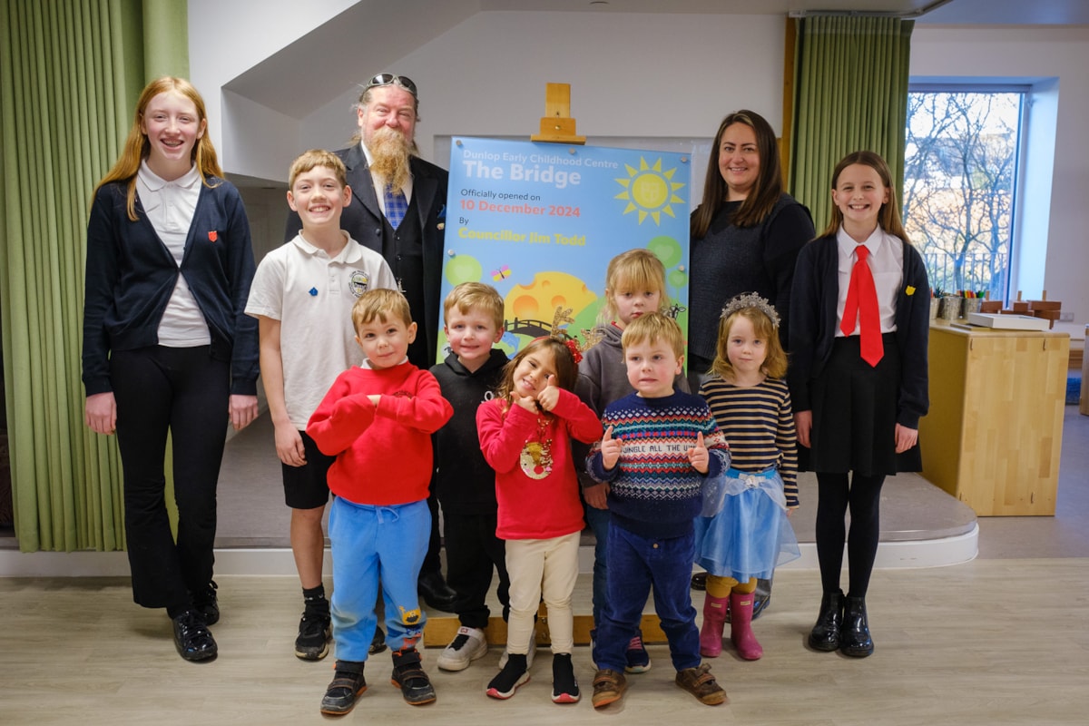 Past Provost Todd with Depute Head Kirsty Mitchel with children from the ECC and Heidi, Murray and Oral, Dunlop PS school captains