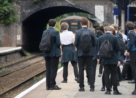 Image shows schoolchildren waiting arrival of a Northern service