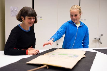 Bridget tells Curator Mhairi Maxwell abour her climate protest placard at the National Museums Colletion Centre. Photo (c) Duncan McGlynn (2)