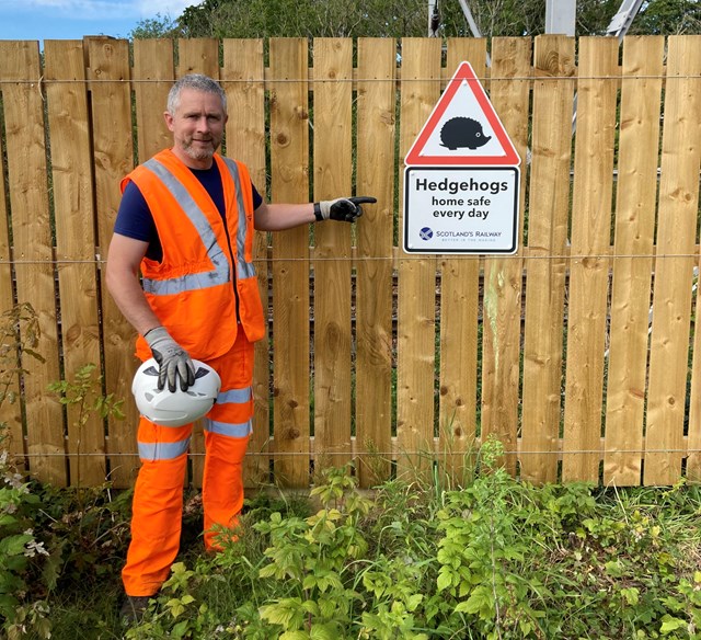 Hedgehog highway plan on track in Glasgow’s southside.: Jonathan Callis with Hedgehog sign at Muirend