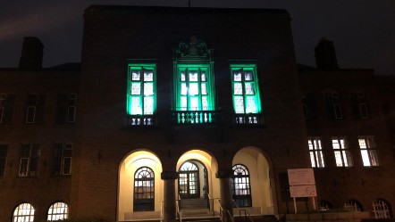Council house lit in green