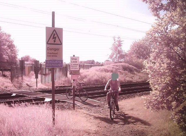 Children cycling on Penny's level crossing