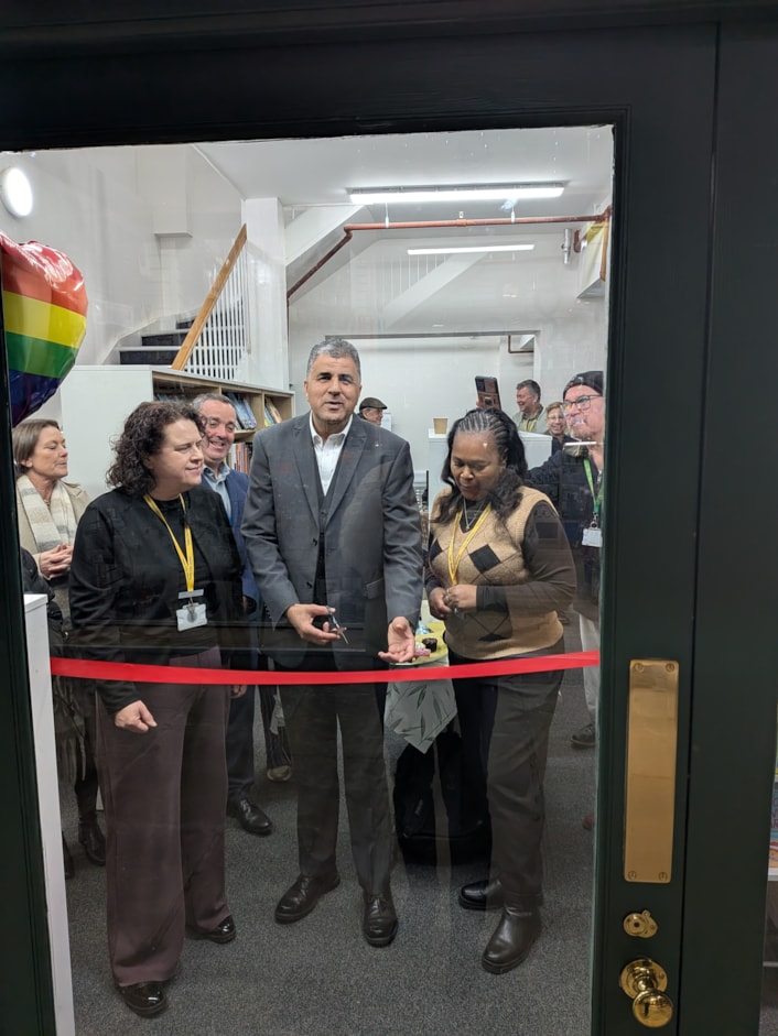 Kirkgate Community Hub opening-2: Councillor Khan cutting the ribbon at the reopening of Kirkgate Community Hub and Library.