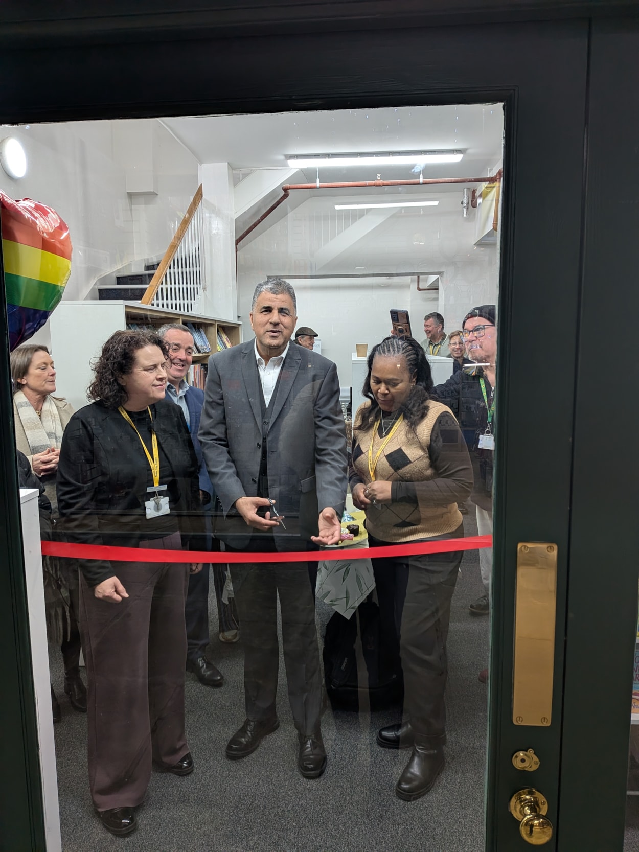 Kirkgate Community Hub opening-2: Councillor Khan cutting the ribbon at the reopening of Kirkgate Community Hub and Library.