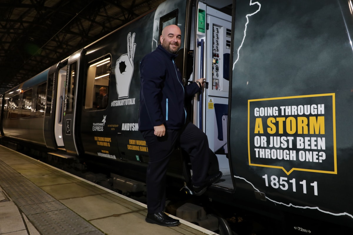 Ian Watson, 39, TPE Driver and Andy's Man Club member, boards the newly wrapped train for its inaugural journey