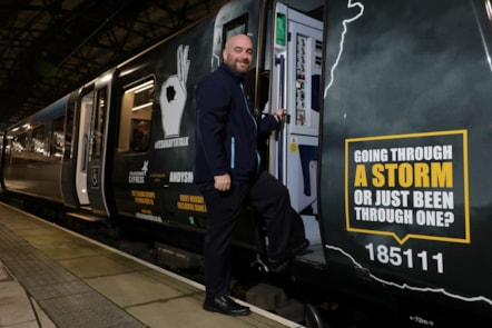 Ian Watson, 39, TPE Driver and Andy's Man Club member, boards the newly wrapped train for its inaugural journey