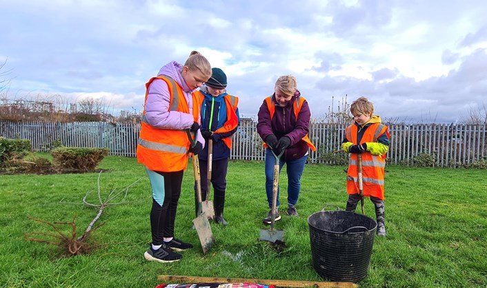 First community trees planted for Armley Gyratory highways scheme: Family children tree planting 14 Jan