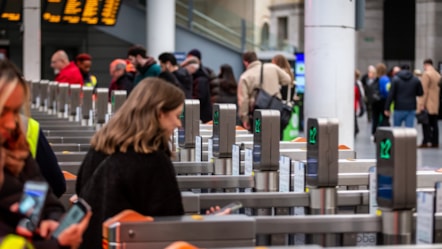 Customers walking through a gateline at Manchester Victoria station cropped