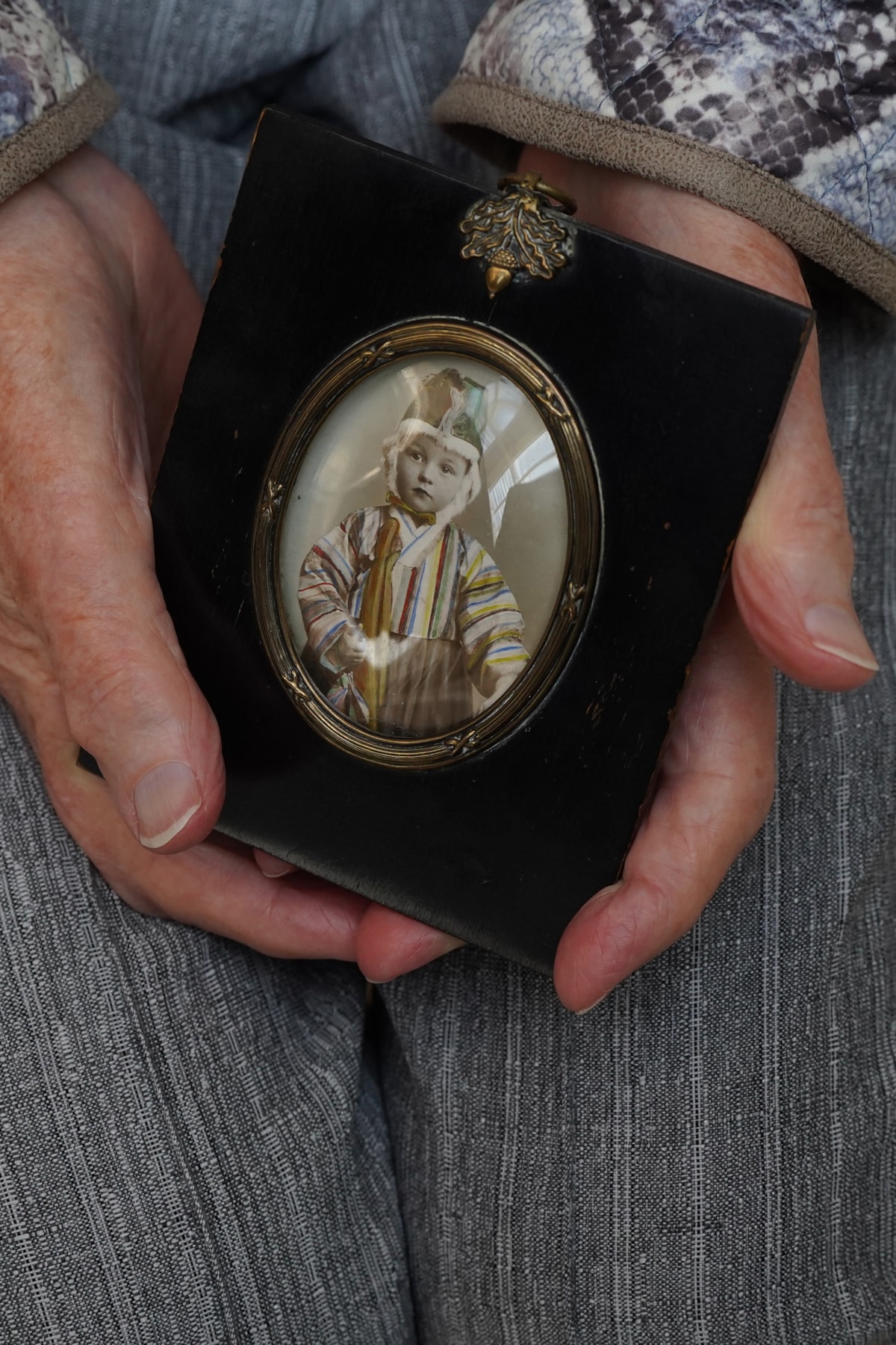Mary Davidson Smith, 104, holds a childhood photograph. Photo © Stewart Attwood (1)