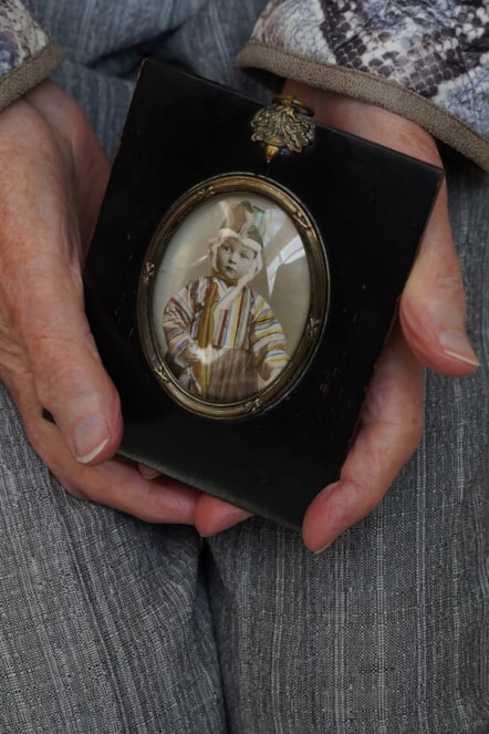 Mary Davidson Smith, 104, holds a childhood photograph. Photo © Stewart Attwood (1)