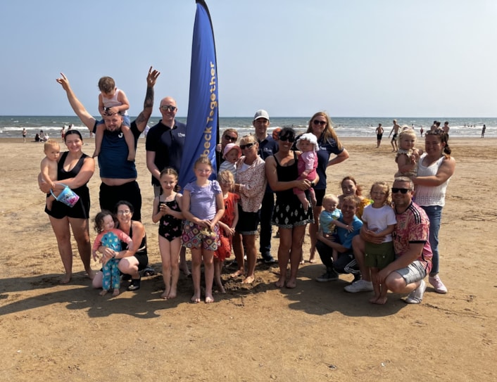 Child Friendly Leeds - Holbeck Together A: Winner of Children's Choice Award, Holbeck Together supports children and families across south Leeds, by providing meals in school holidays and hosting activities and days out. Children and families are pictured on a previous trip to the coast.