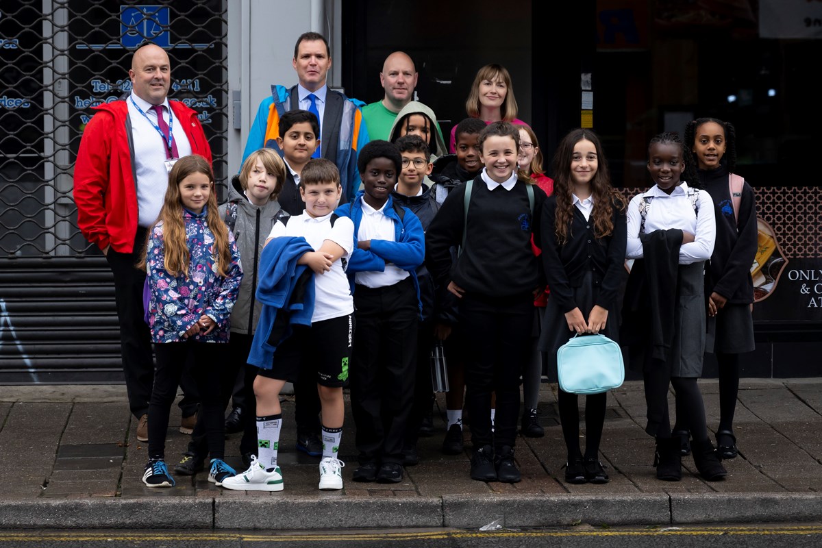 Deputy Minister for Climate Change with responsibility for Transport, Lee Waters with children and teachers from Albany Primary School, Roath, Cardiff