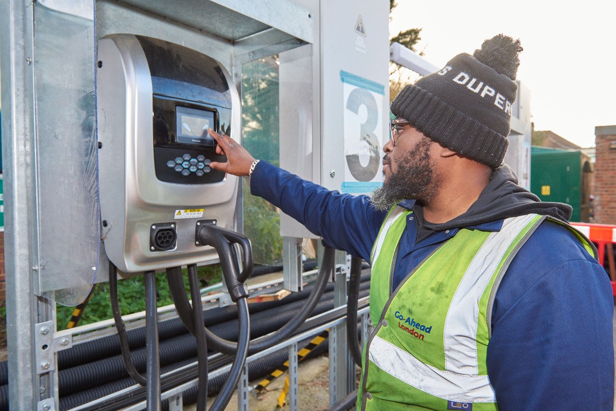 An apprentice engineer, Darren Abbey, charges a zero emission electric bus at Go-Ahead's Bexleyheath depot in south-east London.