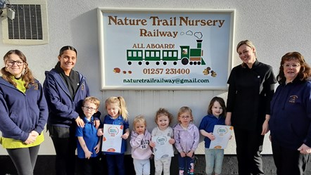 Staff and youngsters celebrate at Nature Trail Nursery 