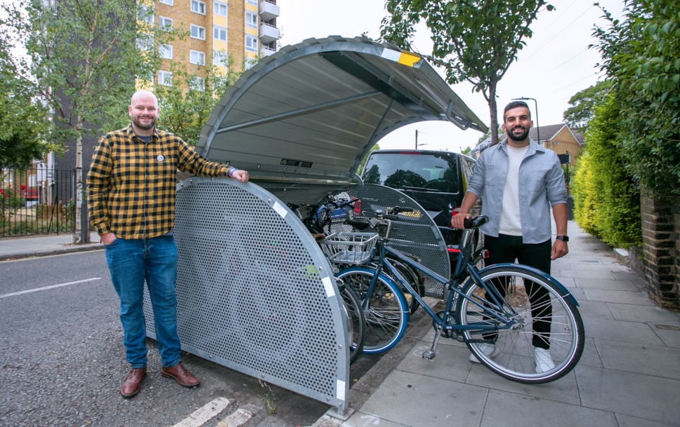 Mayor Philip Glanville and Cllr Mete Coban with an existing hangar on Eleanor Road