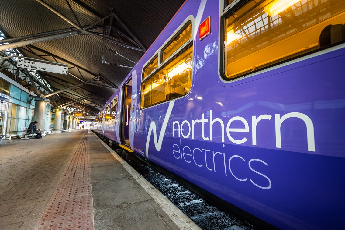 The first Northern Rail electric train to operate between Liverpool Lime Street station and Manchester Airport station