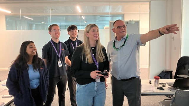 Malcolm (right) with graduates at the Gresley Institute: Malcolm (right) with graduates at the Gresley Institute