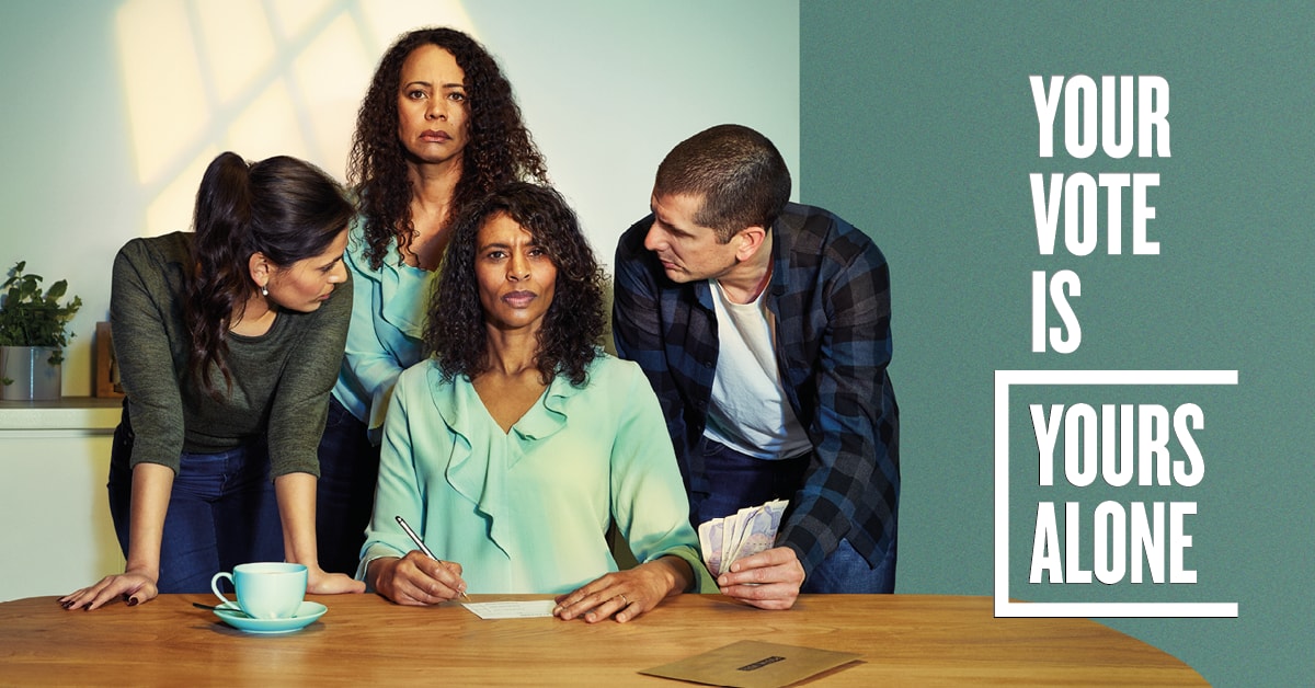 Yourvoteisyoursalone: Graphic showing a woman with a ballot paper being pressured by people around her and slogan 'Your vote is yours alone'