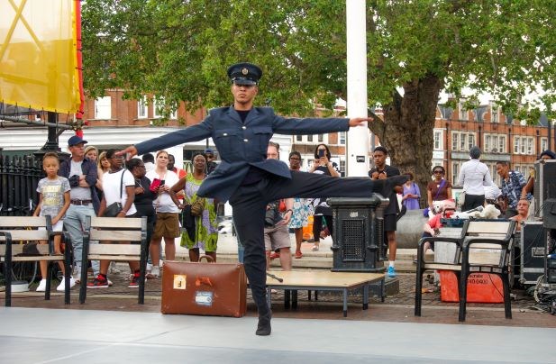 Young, male black dancer performing in Island Movements