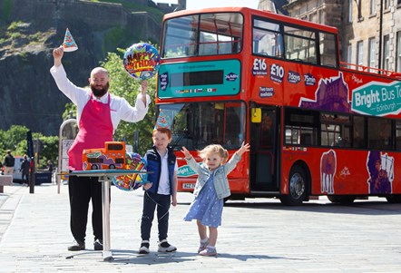 Youngsters Clark (4) and Libby (2) helped local baker unveil a special birthday cake to celebrate two years of Bright Bus Tours in Edinburgh City Centre.