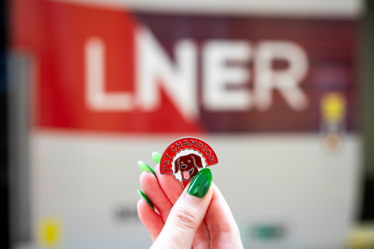 LNER Pet Champion Pin Badge in front of LNER Azuma Train