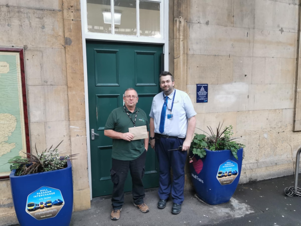 Mark Wood with representative from Hull Foodbank