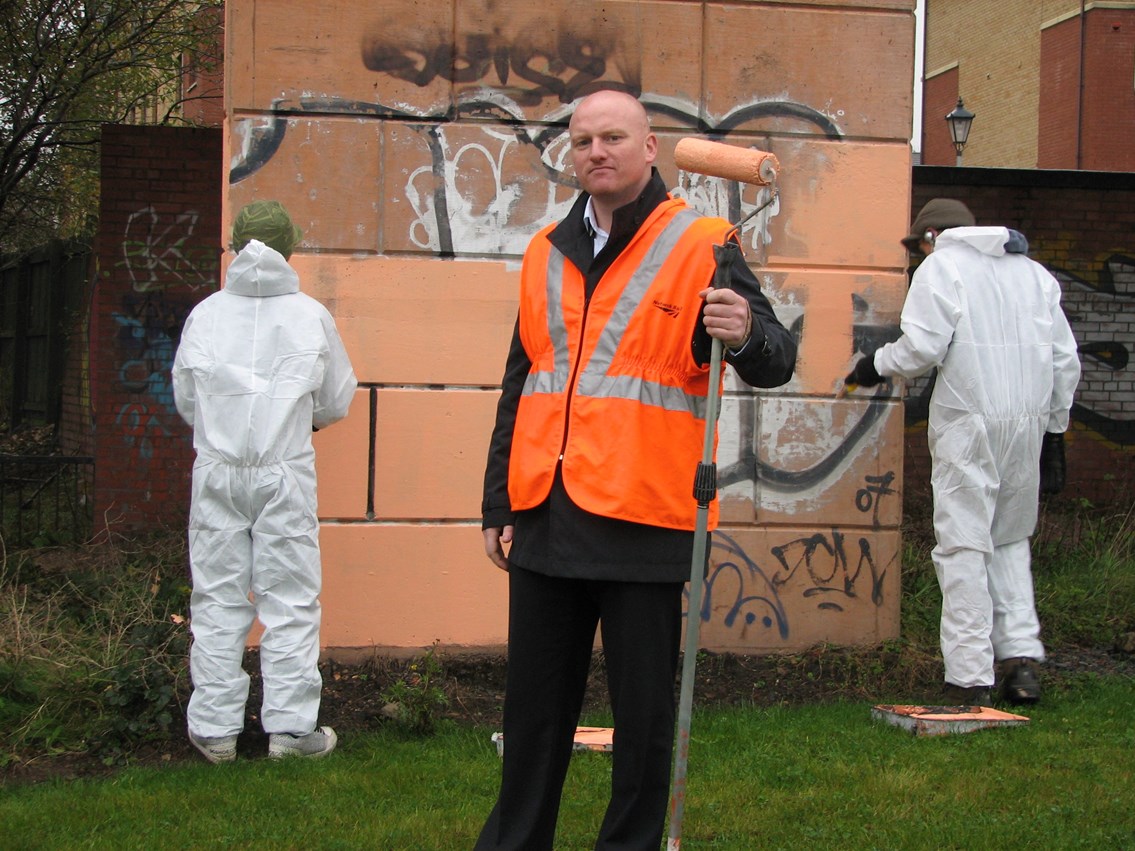 Vandals come clean: Mark Henderson, Community Safety Manager on site in the West End of Glasgow with two grafitti vandals participating in the restorative justice programme.