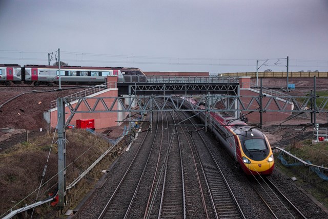 Opened: £250m Norton Bridge flyover – March 2016: A Virgin Trains service passes underneath a CrossCountry service as it passes over the new Norton Bridge flyover, which was brought into use over the Easter 2016 weekend.