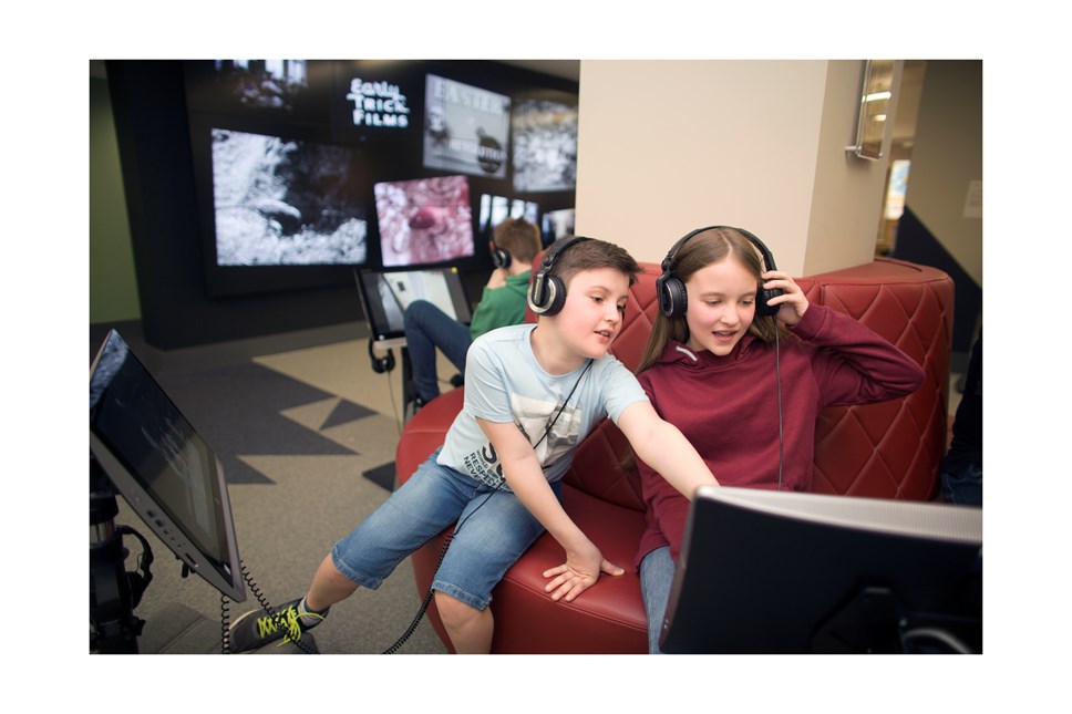 Young people exploring digital film content at the National Library of Scotland’s Moving Image Archive at Kelvin Hall, Glasgow.