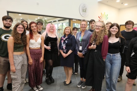 Lynne Neagle cabinet secretary for education congratulates some of the successful students during her visit to the Yale campus, Wrexham