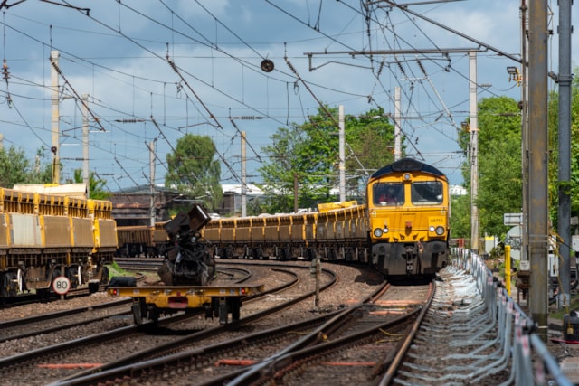 Warrington - Dallam Junction engineering train carrying ballast waiting in the wings: Warrington - Dallam Junction engineering train carrying ballast waiting in the wings