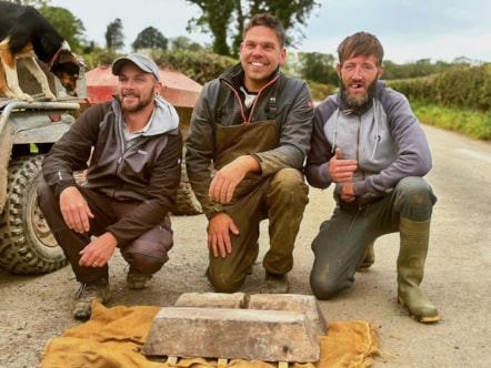 Finders and landowner with lead pigs