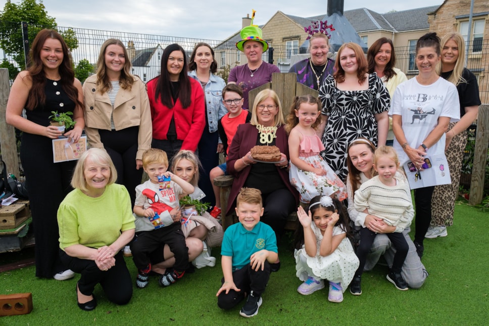 Margaret Blades (centre) with staff and guests at the 80th birthday celebrations
